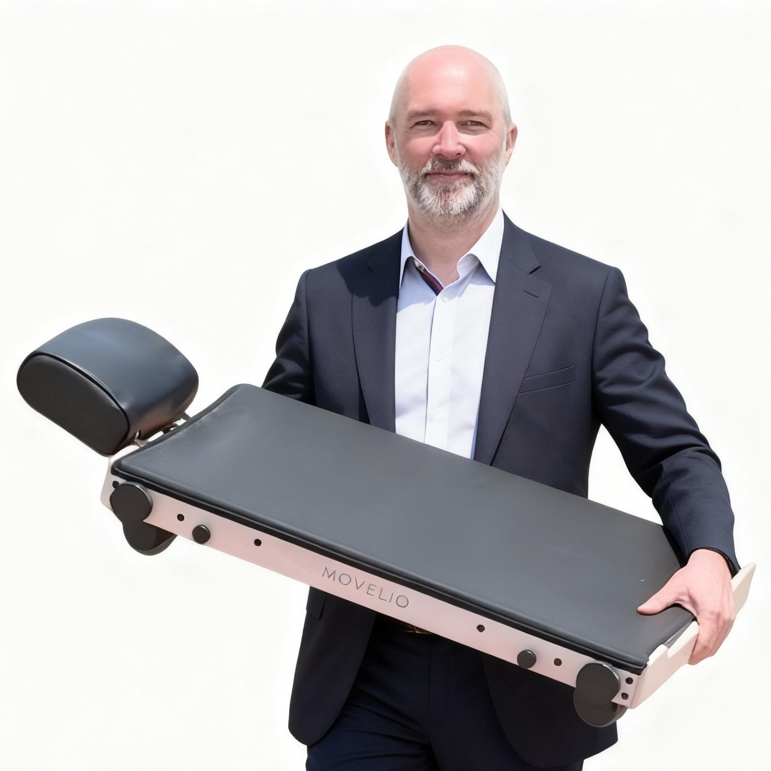 Photo of CEO and Founder of Movelio, Christopher Scheiene holding the Movelio Bed Roller. White background.