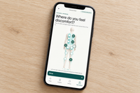 Movelio Smarter Recovery app displayed on a smartphone, with body map and selected massage areas.