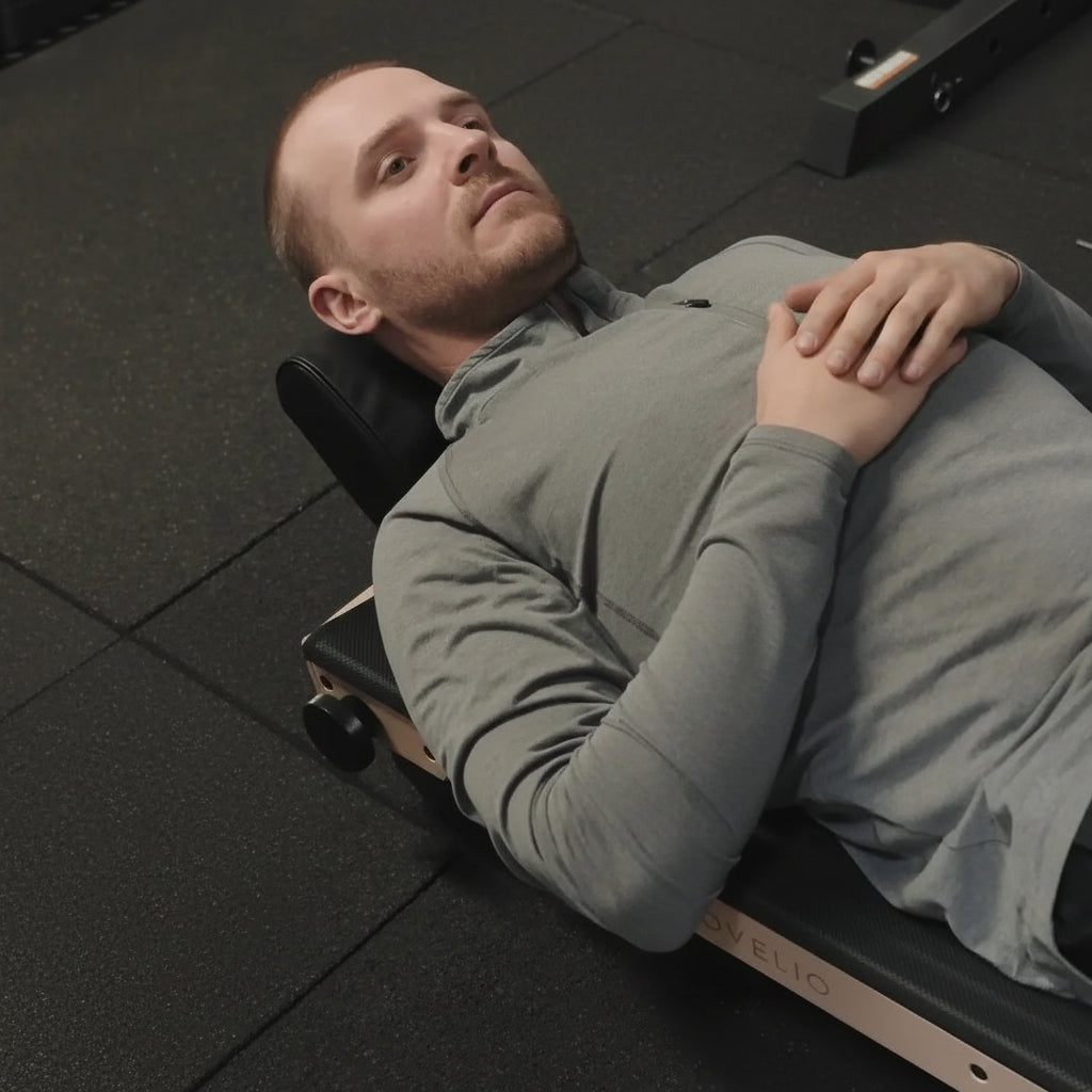 Physiotherapist guiding a user on Movelio Bed Roller